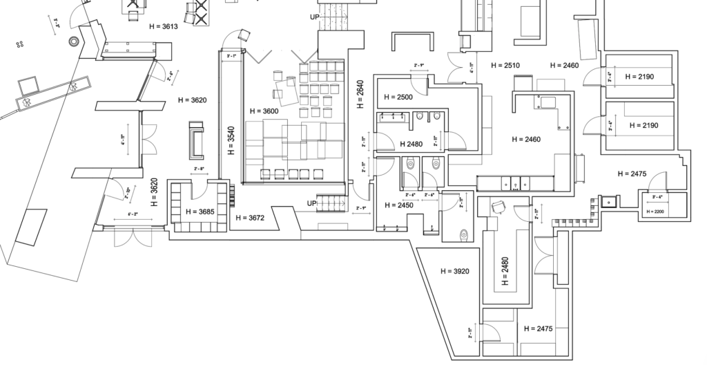 CAD floor plan of an irregular restaurant layout with room-by-room ceiling height annotations
